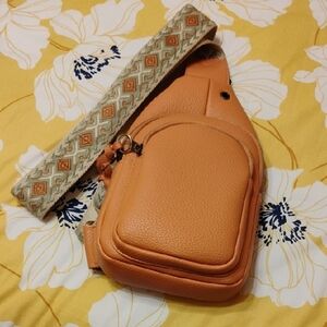 Stylish Tan Crossbody Bag with Patterned Strap